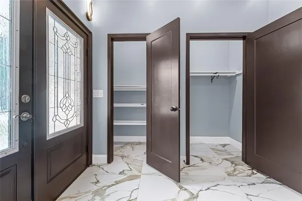 a bathroom with a glass door shower and a sink