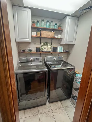 a stove top oven sitting inside of a kitchen