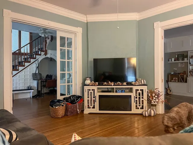 a living room with furniture and a flat screen tv
