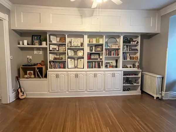 a view of a livingroom with furniture and staircase