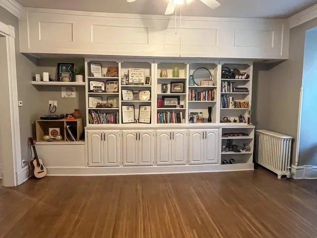 a view of a livingroom with furniture and staircase