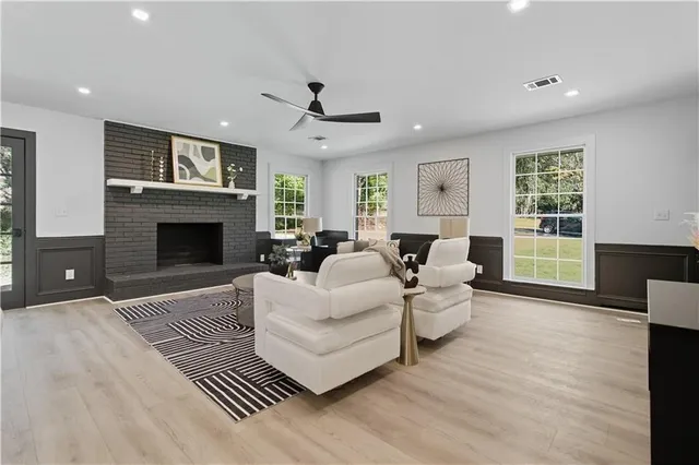 a living room with furniture dining table and a fireplace