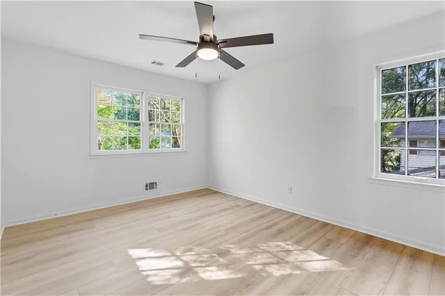 a view of a barn in the middle of a yard