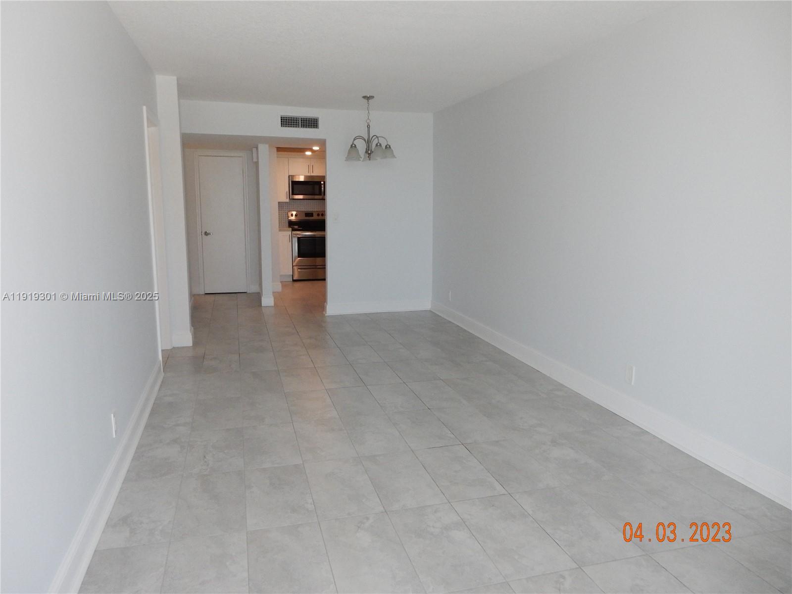 400 North Surf Road, Unit 303 Hollywood, FL 33019 - Photo 17 of 17 an empty room with an empty space and windows