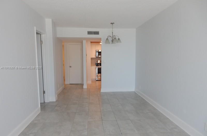 400 North Surf Road, Unit 303 Hollywood, FL 33019 - Photo 4 of 17 wooden floor in an empty room