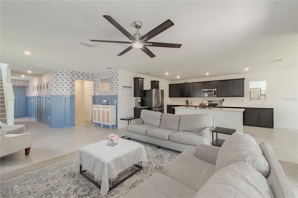 20864 Cherry River Road Land O' Lakes, FL 34638 - Photo 12 of 48 a living room with furniture and kitchen view