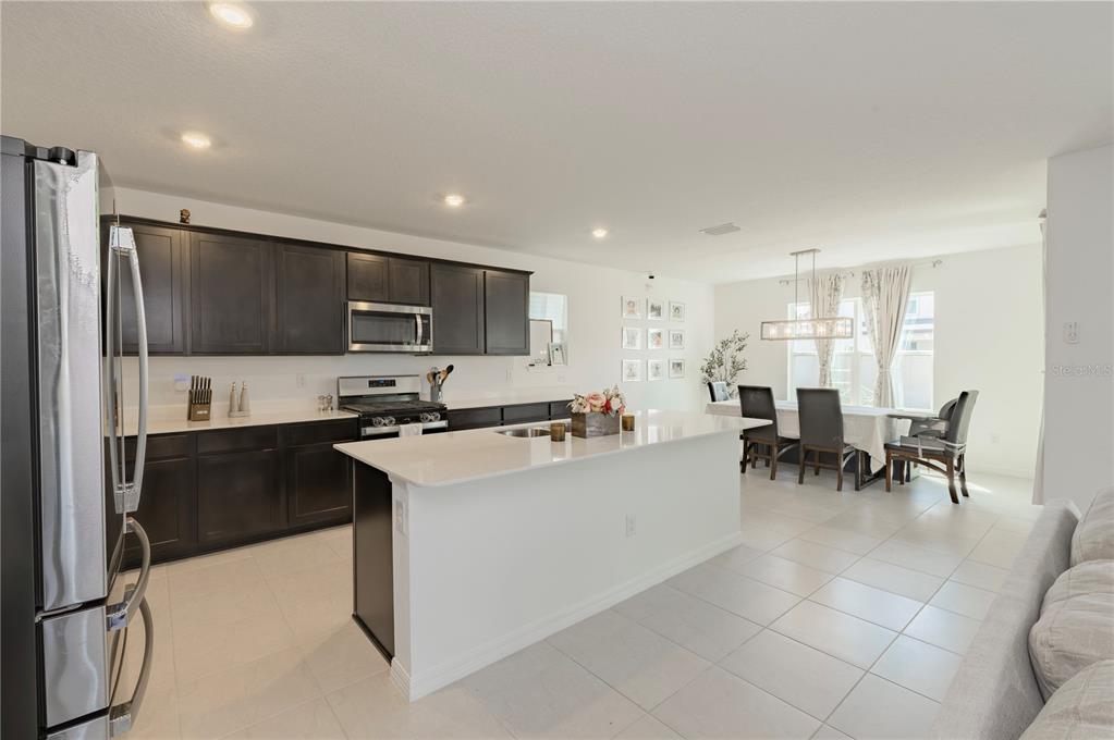20864 Cherry River Road Land O' Lakes, FL 34638 - Photo 13 of 48 a kitchen with appliances cabinets and a sink