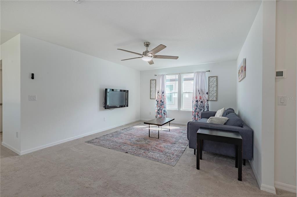 20864 Cherry River Road Land O' Lakes, FL 34638 - Photo 18 of 48 a living room with furniture and a window