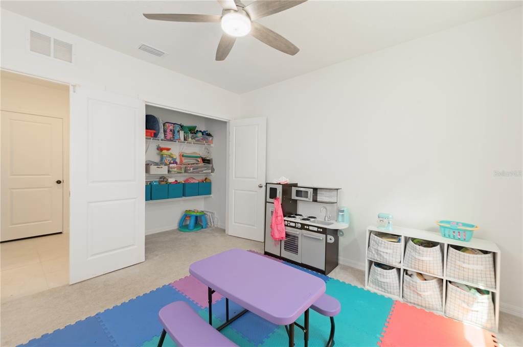 20864 Cherry River Road Land O' Lakes, FL 34638 - Photo 37 of 48 a living room with furniture and a wooden floor