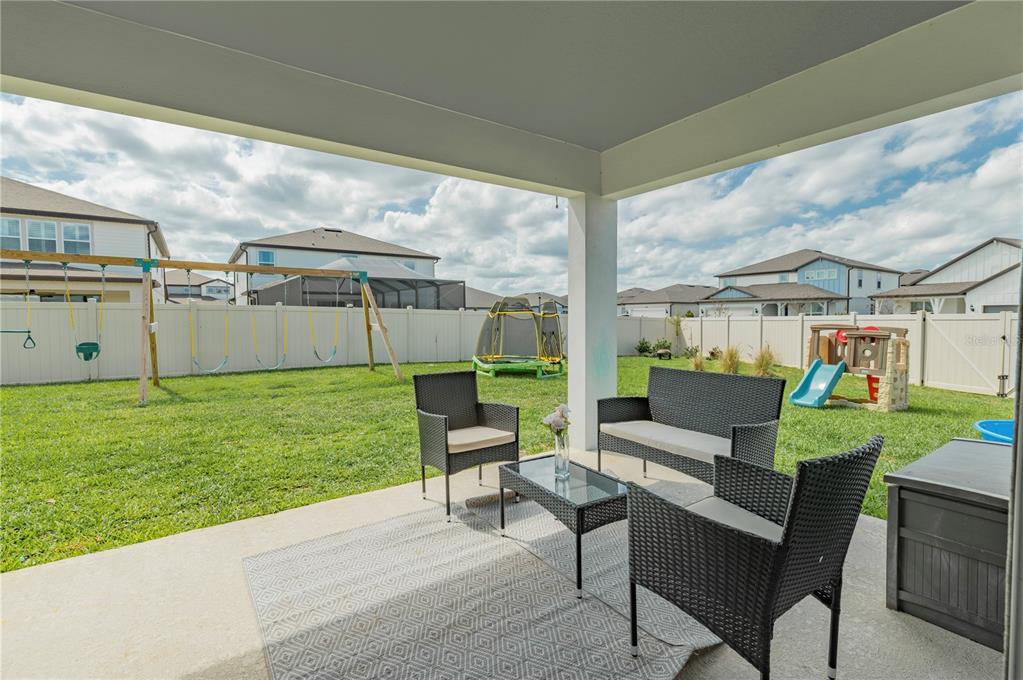 20864 Cherry River Road Land O' Lakes, FL 34638 - Photo 39 of 48 a view of backyard with seating area and green space