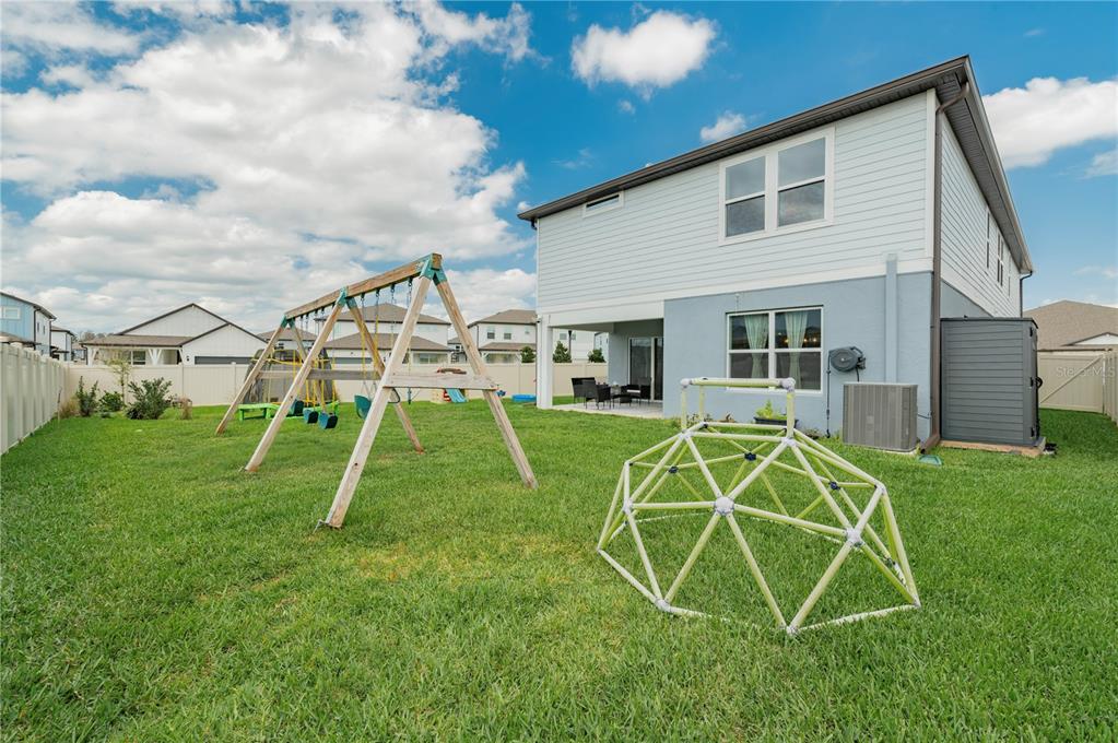 20864 Cherry River Road Land O' Lakes, FL 34638 - Photo 40 of 48 a view of a yard with a slide