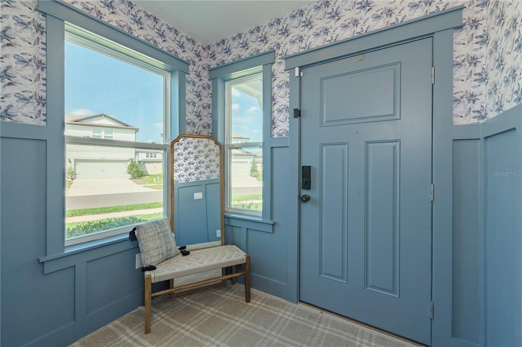 20864 Cherry River Road Land O' Lakes, FL 34638 - Photo 8 of 48 a living room with furniture and a large window
