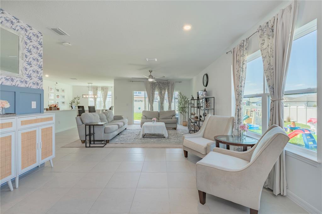 20864 Cherry River Road Land O' Lakes, FL 34638 - Photo 9 of 48 a living room with furniture and a large window