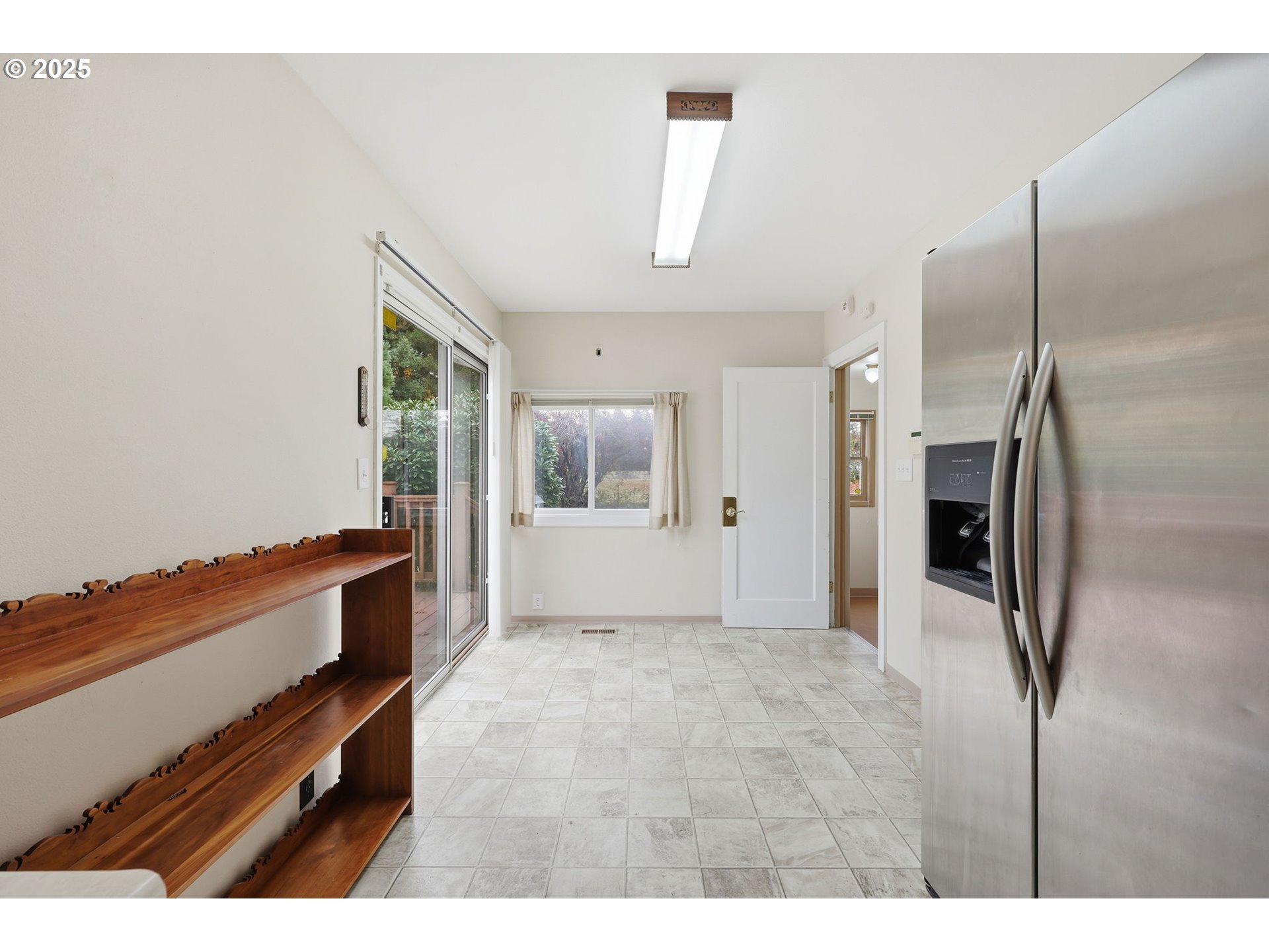 11040 Southeast McCreary Lane Boring, OR 97009 - Photo 12 of 38 a kitchen with stainless steel appliances kitchen island a refrigerator and a stove
