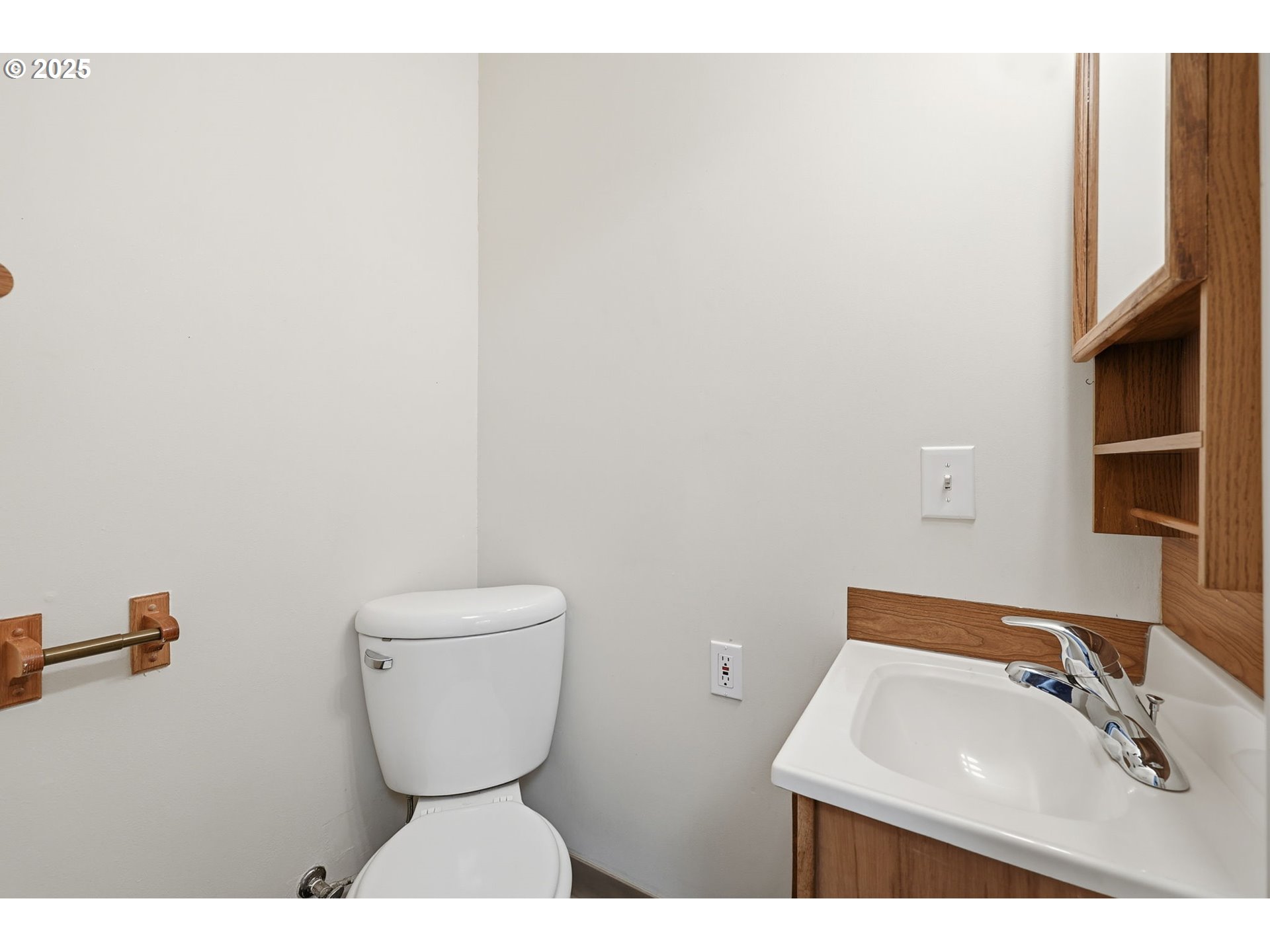 11040 Southeast McCreary Lane Boring, OR 97009 - Photo 17 of 38 a bathroom with a toilet sink and mirror