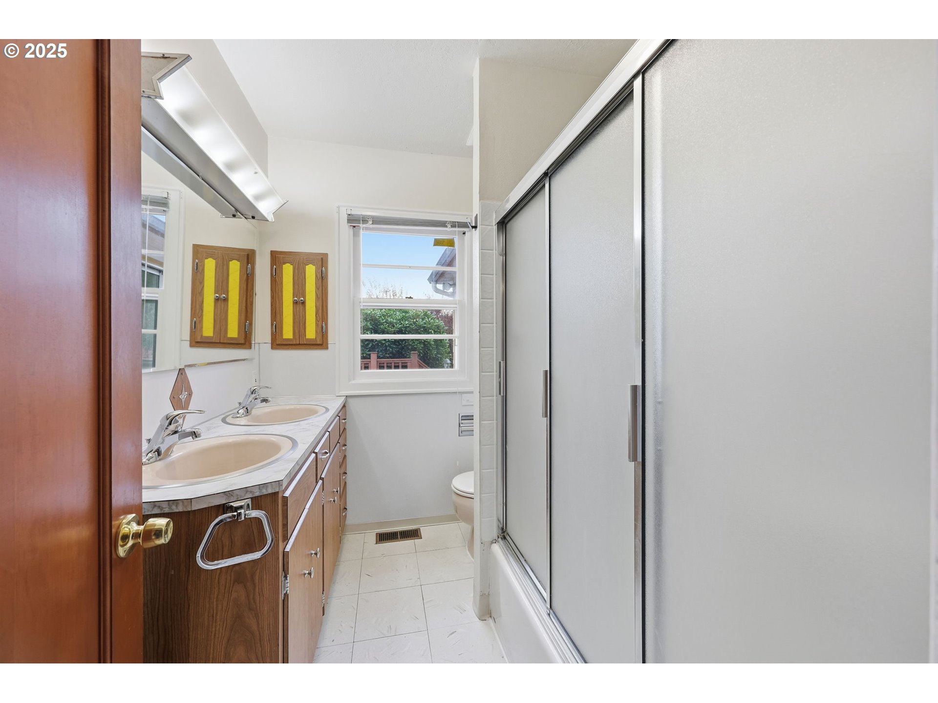 11040 Southeast McCreary Lane Boring, OR 97009 - Photo 22 of 38 a bathroom with a sink a mirror and a window