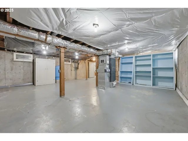a view of empty room with wooden ceiling