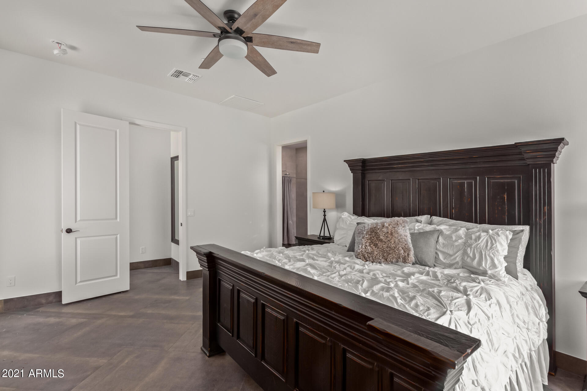 27808 Desierto Drive Rio Verde, AZ 85263 - Photo 21 of 42 a bedroom with a large bed and a ceiling fan