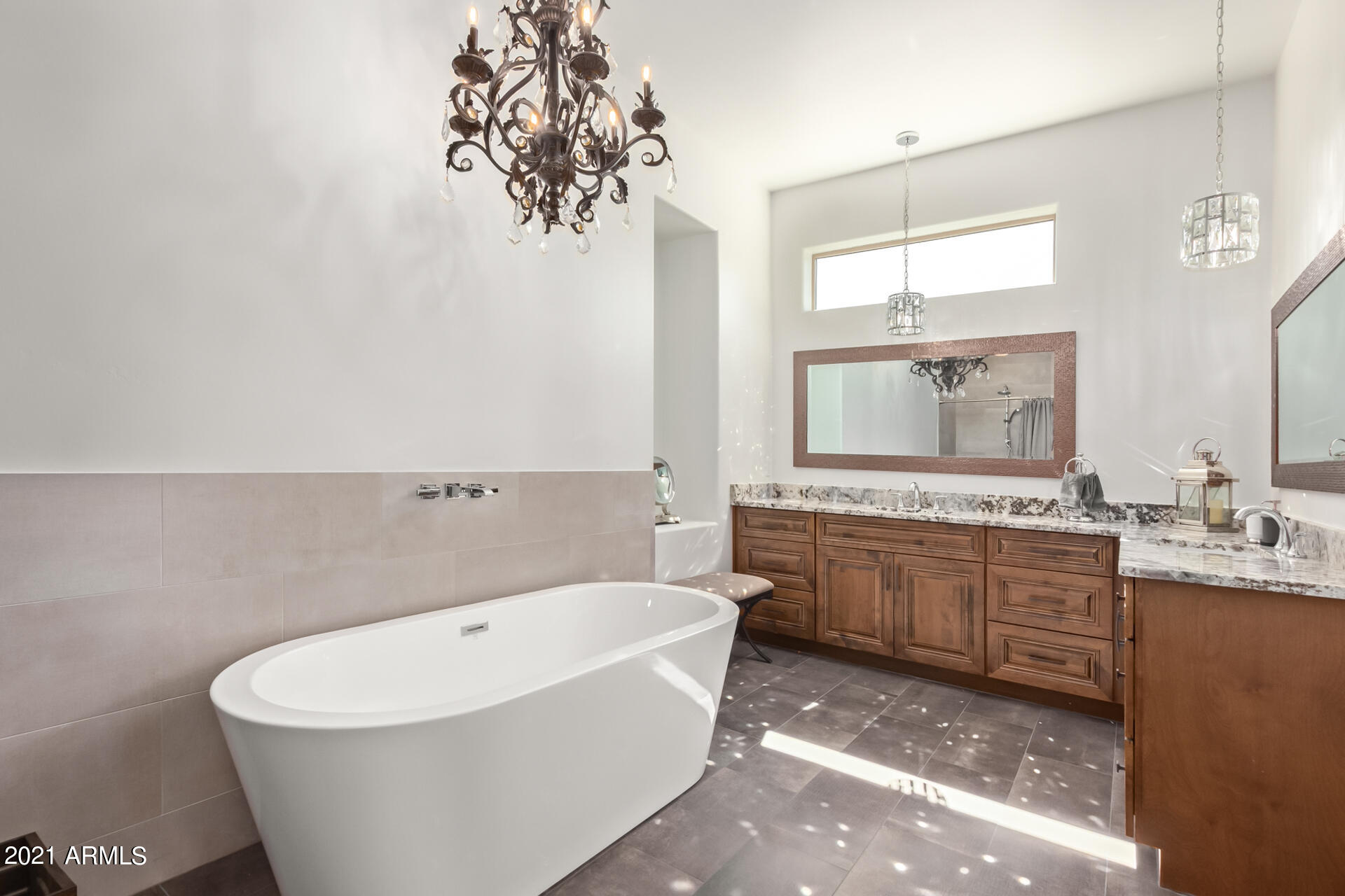 27808 Desierto Drive Rio Verde, AZ 85263 - Photo 23 of 42 a bathroom with a bathtub a mirror a vanity and a sink