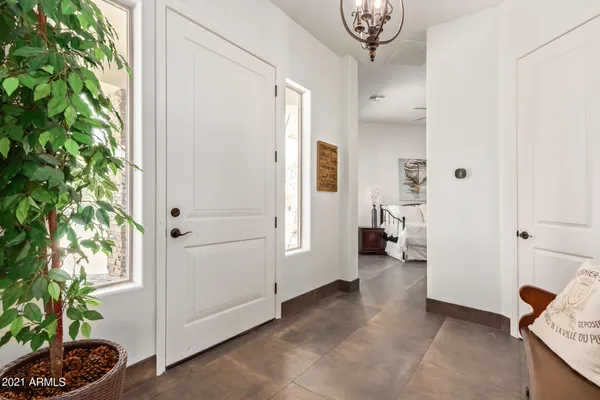 a view of a livingroom with entryway and furniture