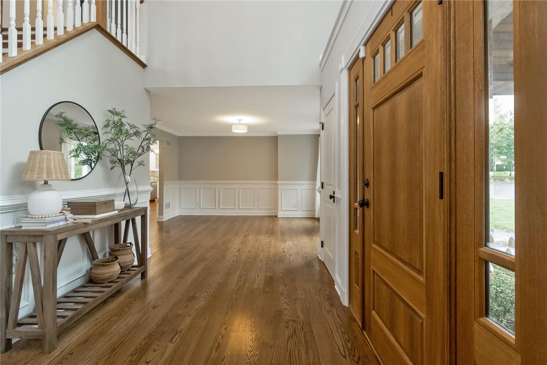 755 Yorkshire Road Allentown, PA 18103 - Photo 8 of 66 Rich hardwood floors welcome guests into an airy foyer featuring a classic wood entry door.