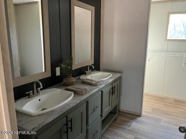 28711 Tracy Road Hilliard, FL 32046 - Photo 13 of 33 a bathroom with a sink and a mirror