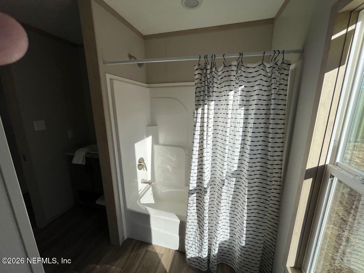 28711 Tracy Road Hilliard, FL 32046 - Photo 20 of 33 a bathroom with a shower