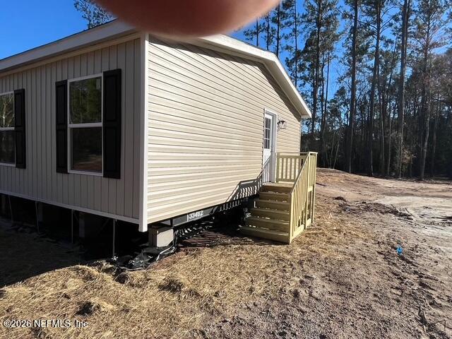 28711 Tracy Road Hilliard, FL 32046 - Photo 28 of 33 a backyard of a house