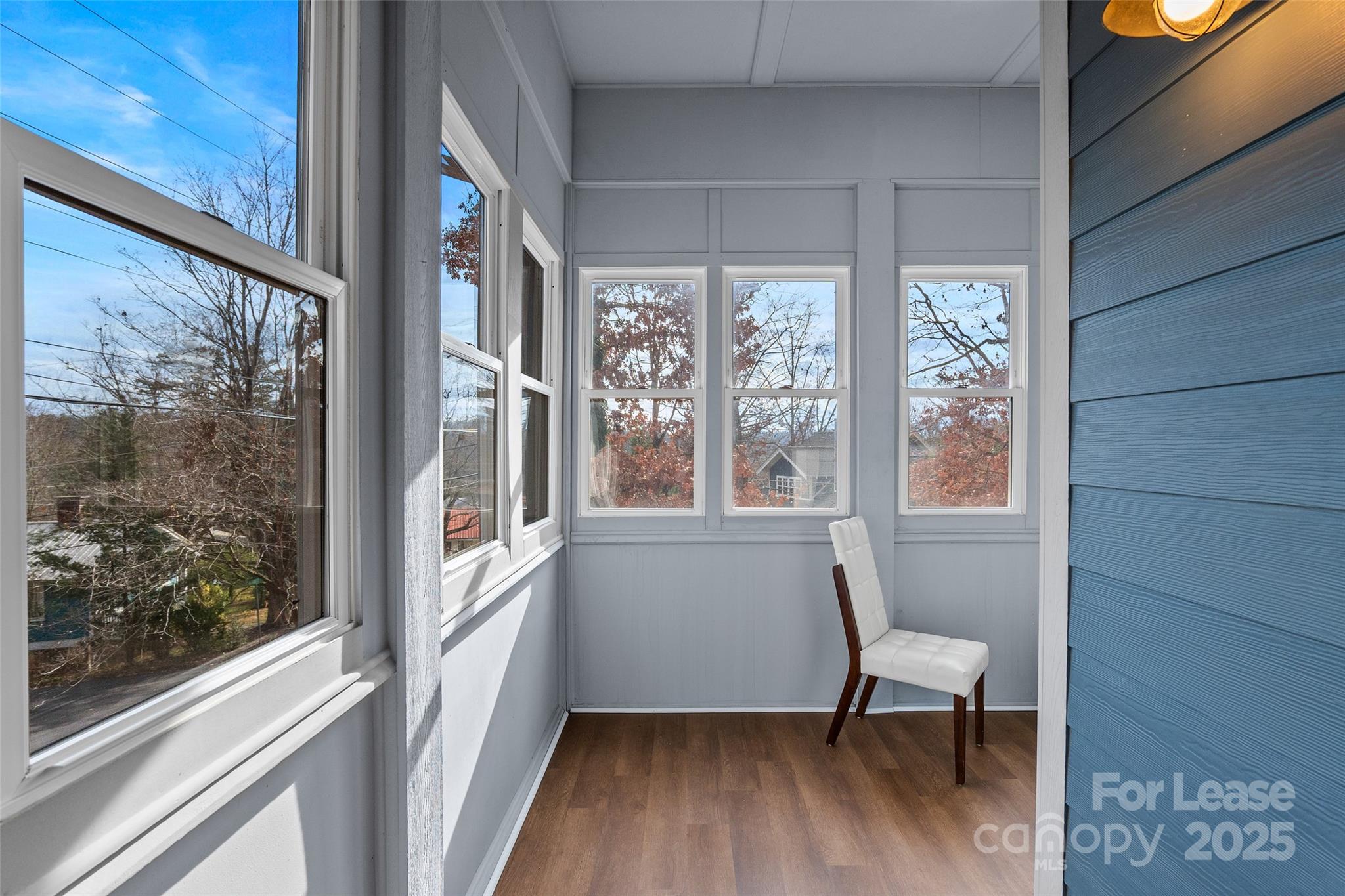 5 Elmore Street Asheville, NC 28804 - Photo 19 of 37 a view of a room with a window and wooden floor