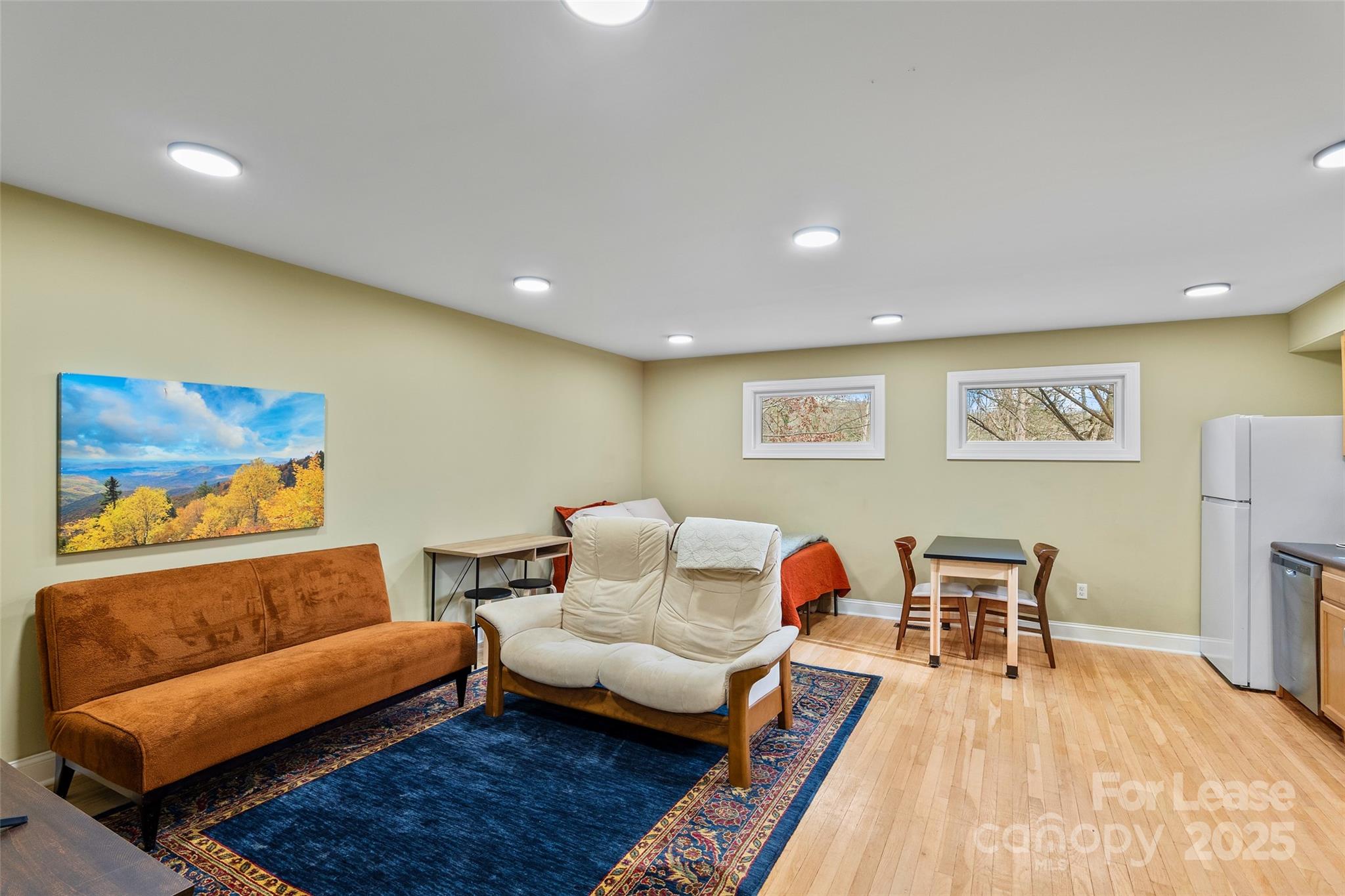 5 Elmore Street Asheville, NC 28804 - Photo 24 of 37 a living room with furniture and a couch