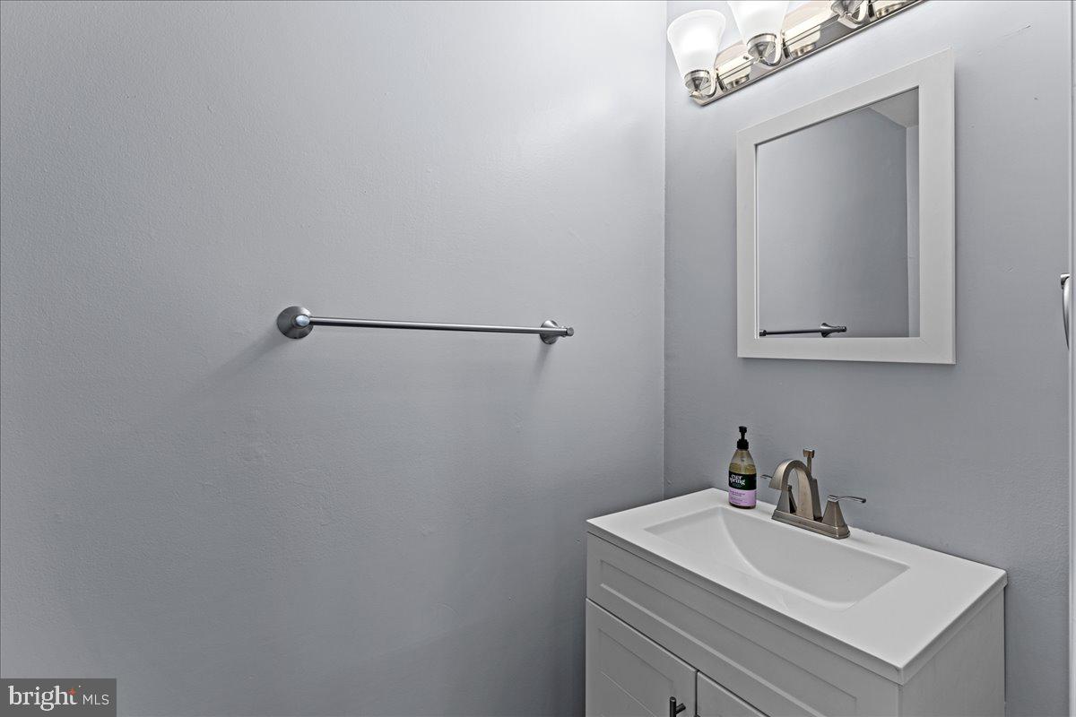 142 Pheasant Lane Willingboro, NJ 08046 - Photo 13 of 24 a bathroom with a sink and mirror