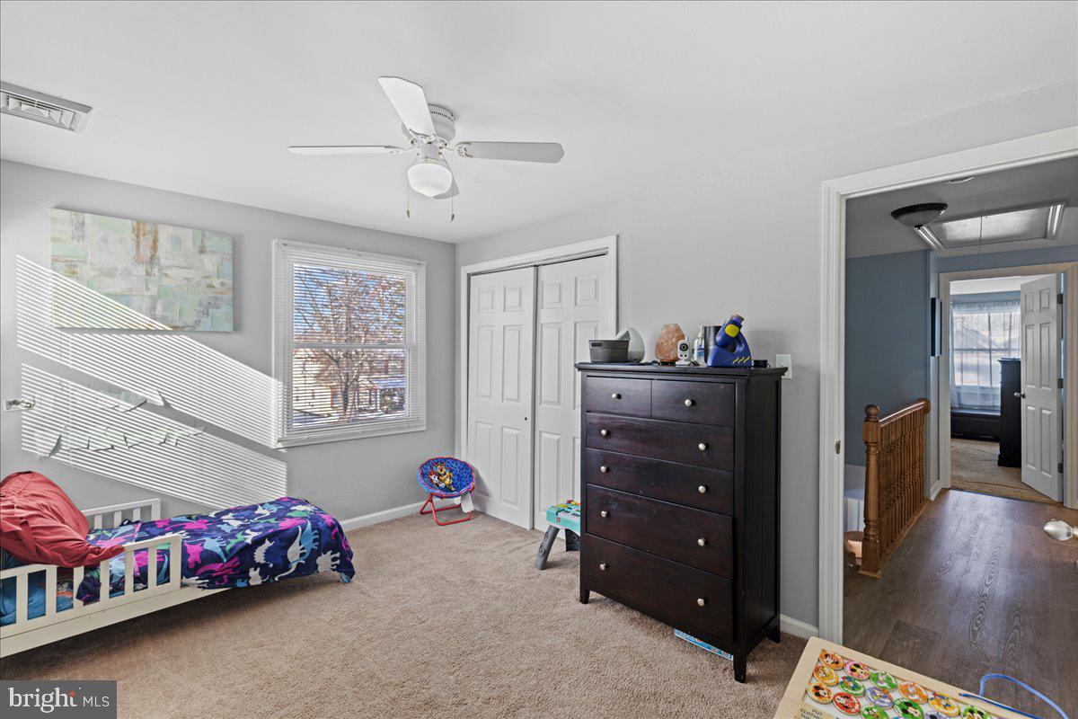 142 Pheasant Lane Willingboro, NJ 08046 - Photo 16 of 24 a bedroom with a bed and wooden floor