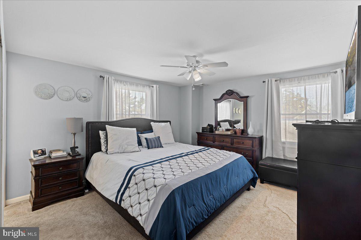 142 Pheasant Lane Willingboro, NJ 08046 - Photo 19 of 24 a bedroom with a bed and wooden floor