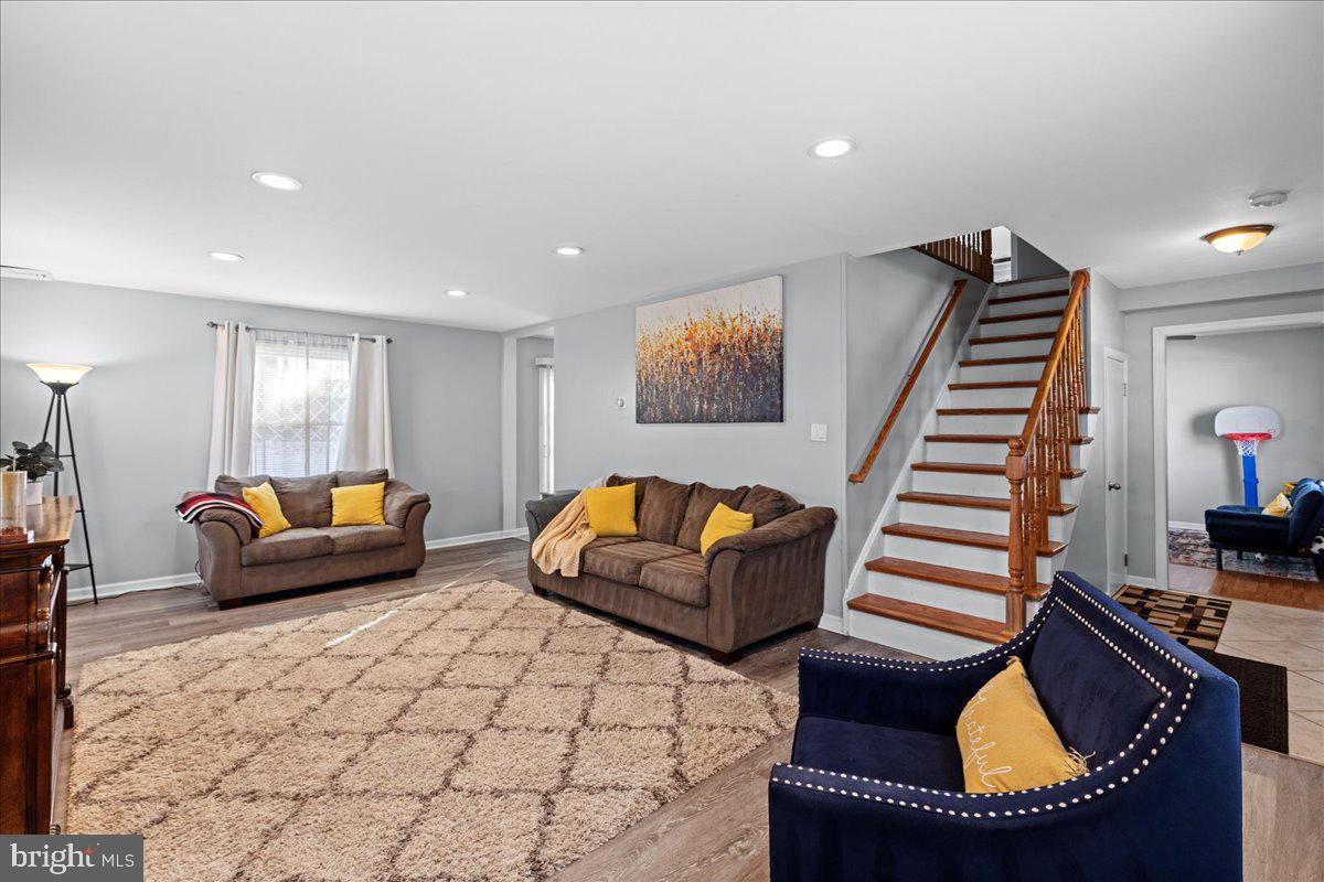 142 Pheasant Lane Willingboro, NJ 08046 - Photo 6 of 24 a living room with furniture and a wooden floor