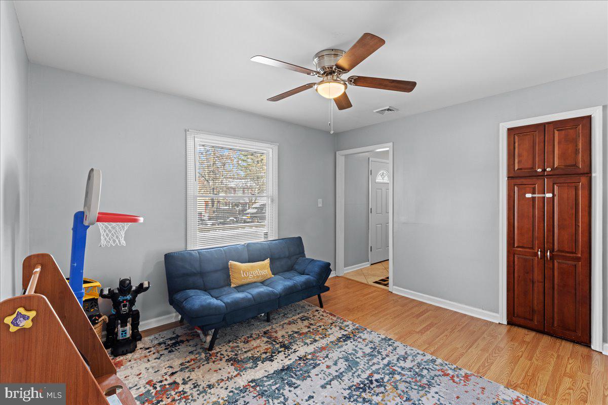 142 Pheasant Lane Willingboro, NJ 08046 - Photo 8 of 24 a living room with furniture and a wooden floor