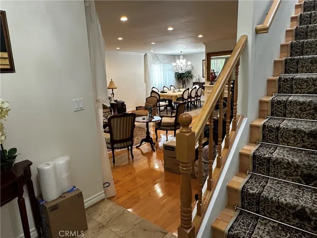 a lobby with furniture and stairs