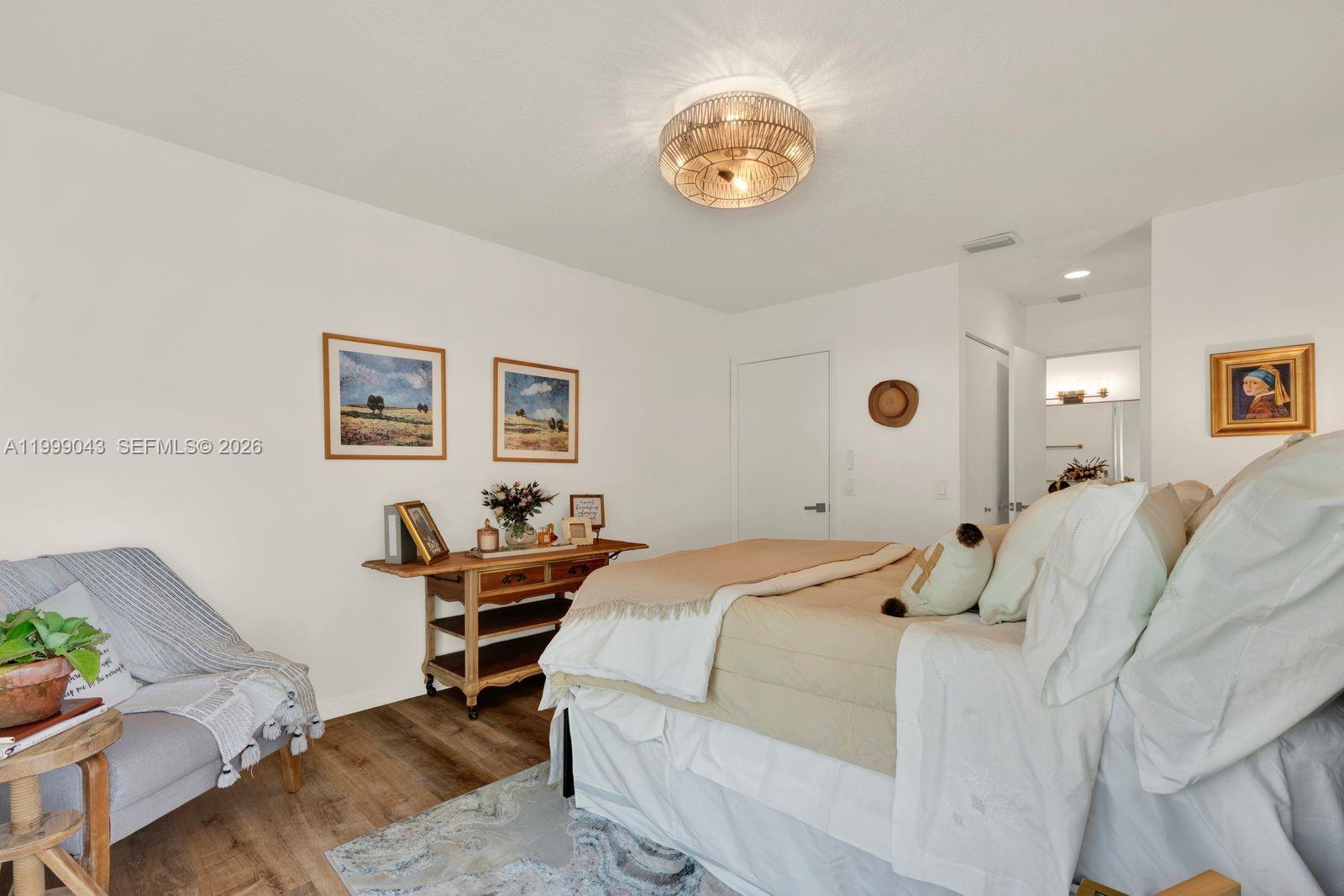 10441 Mahogany Key Circle, Unit 202 Miami, FL 33196 - Photo 14 of 42 a bed room with a bed and a chair