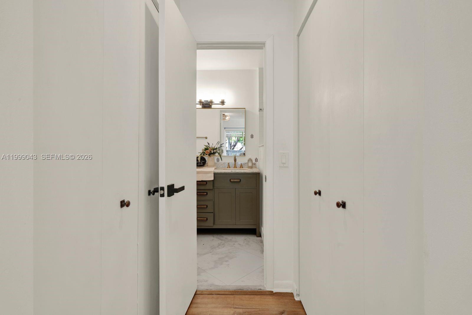 10441 Mahogany Key Circle, Unit 202 Miami, FL 33196 - Photo 15 of 42 a bathroom with a sink and mirror