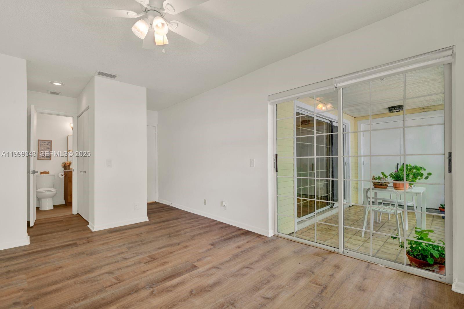 10441 Mahogany Key Circle, Unit 202 Miami, FL 33196 - Photo 19 of 42 a view of an entryway with wooden floor and front door