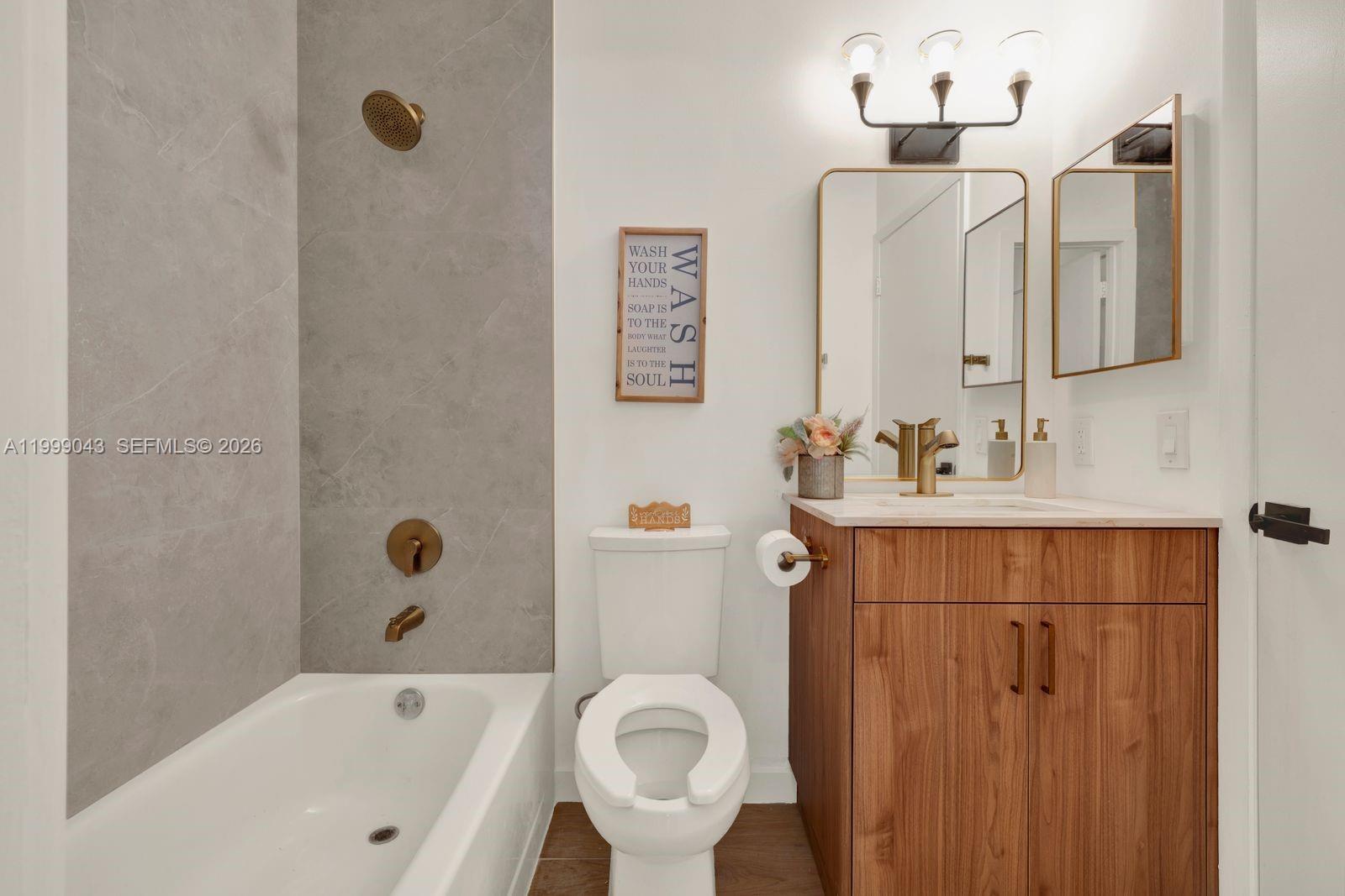 10441 Mahogany Key Circle, Unit 202 Miami, FL 33196 - Photo 24 of 42 a bathroom with a sink a toilet and shower