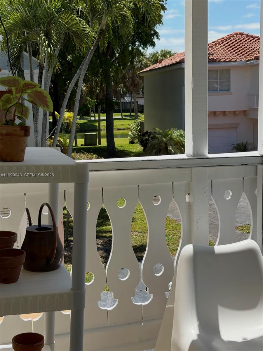 10441 Mahogany Key Circle, Unit 202 Miami, FL 33196 - Photo 26 of 42 a view of a two chair in the balcony