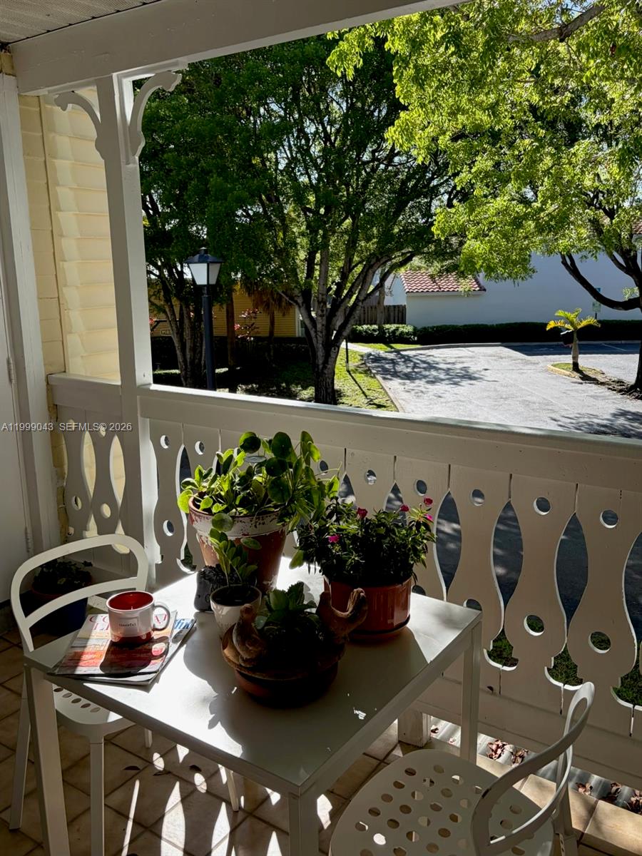 10441 Mahogany Key Circle, Unit 202 Miami, FL 33196 - Photo 27 of 42 a vase of flowers sitting on a table