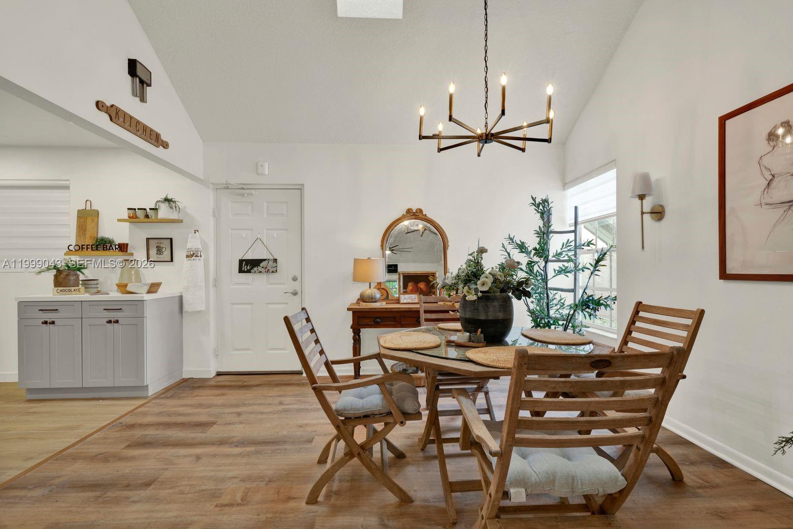 10441 Mahogany Key Circle, Unit 202 Miami, FL 33196 - Photo 3 of 42 a view of a dining room with furniture window and wooden floor