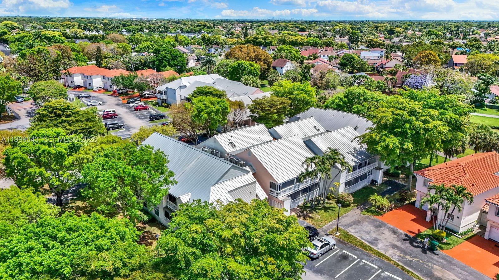 10441 Mahogany Key Circle, Unit 202 Miami, FL 33196 - Photo 37 of 42 an aerial view of residential house with outdoor space and trees all around