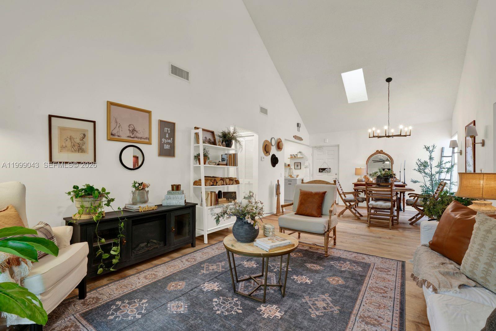 10441 Mahogany Key Circle, Unit 202 Miami, FL 33196 - Photo 4 of 42 a living room with furniture and a table