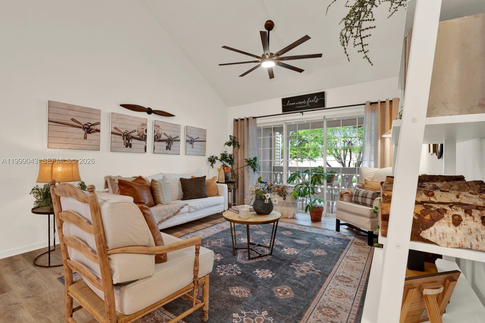 10441 Mahogany Key Circle, Unit 202 Miami, FL 33196 - Photo 5 of 42 a living room with furniture and a large window