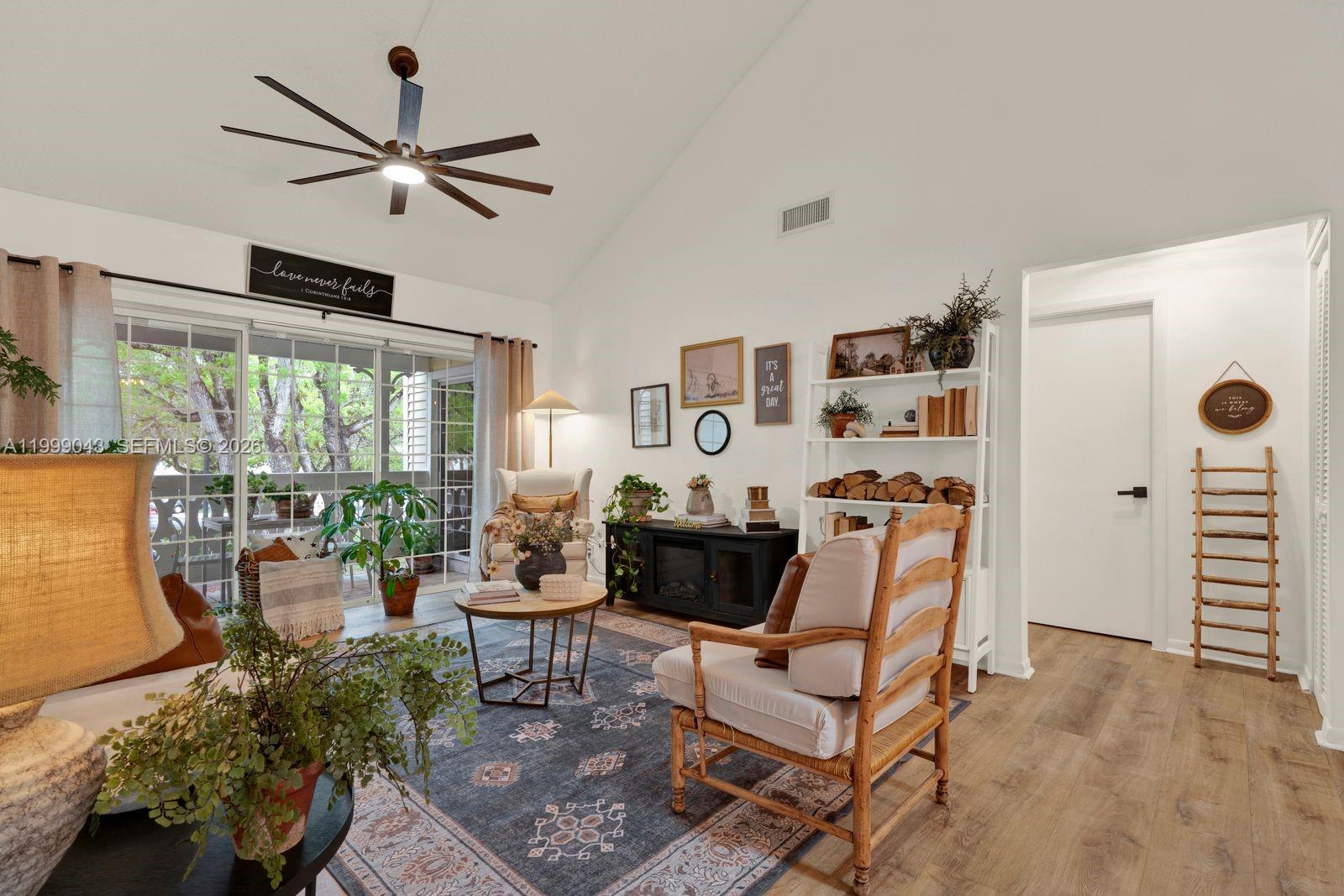 10441 Mahogany Key Circle, Unit 202 Miami, FL 33196 - Photo 6 of 42 a living room with furniture and a window