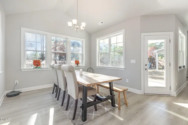a view of a dining room with furniture window and outside view