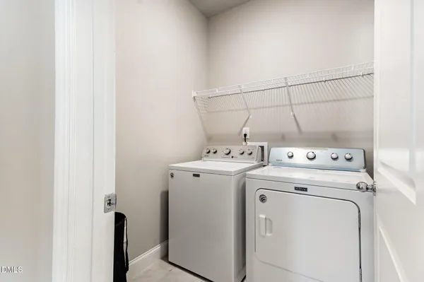 a view of storage and utility room with washer and dryer