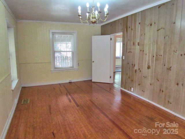 3465 Lynn Road Tryon, NC 28782 - Photo 18 of 31 a view of an empty room with wooden floor and a window